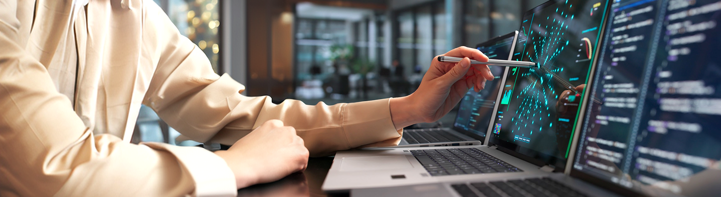 Person tapping computer screen with stylus